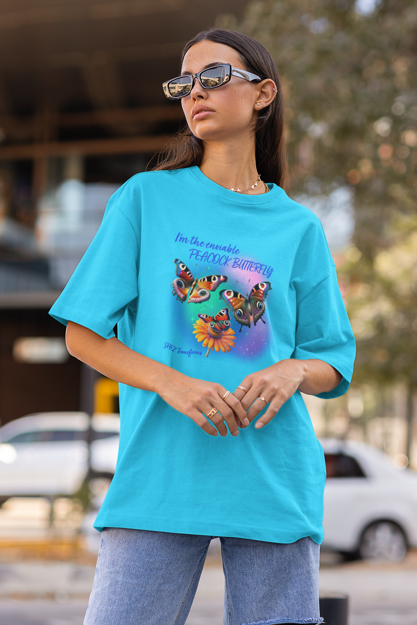 Shez Transforms Peacock Butterfly Sky Blue Oversized women Tshirts & Women Tops, Size : S , M, L, XL, 2XL, 3XL, 4XL, 5XL. Model in Goggles Front Pose